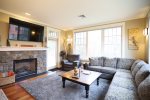 Open Living Room with Access to Outdoor Seating area in Loon Condo